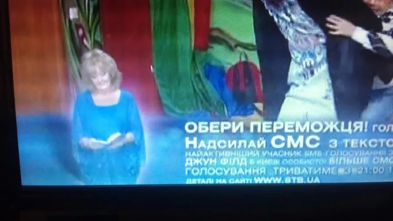 International Battle of the Psychics voting advert on Ukrainian television, showing June Field