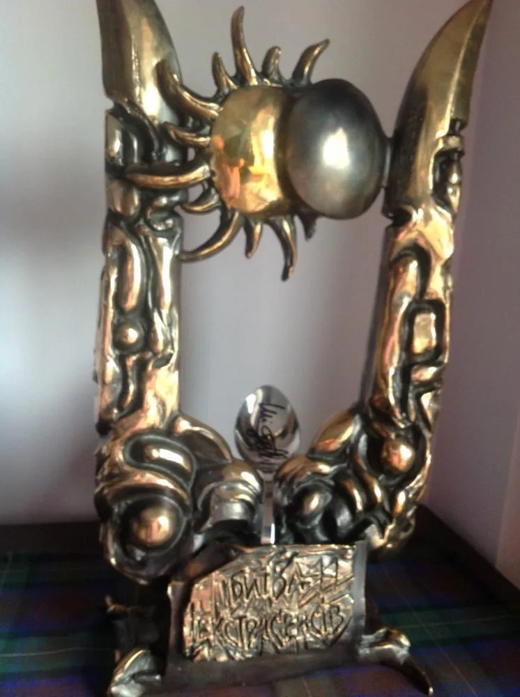 The International Battle of the Psychics trophy, with Uri Geller's bent and signed spoon